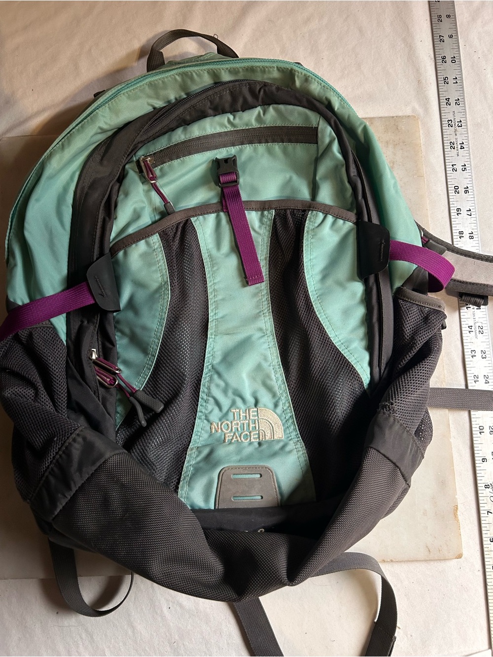 The North Face Recon Mint Green and Charcoal Backpack with Purple Pull Tabs